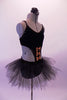 Black velvet camisole leotard dress has large cut-out side and is edged with topaz crystals. The front center of the torso has three shiny bronze bow accents. The attached tulle tutu style skirt gives the costume a quirky style. Comes with a black floral hair accessory. Side