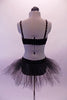 Black velvet camisole leotard dress has large cut-out side and is edged with topaz crystals. The front center of the torso has three shiny bronze bow accents. The attached tulle tutu style skirt gives the costume a quirky style. Comes with a black floral hair accessory. Back