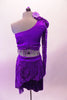 2-piece purple costume has a single shoulder half top with long lace sleeve. The right shoulder has an epaulette with purple morning glory flowers & dangling sequins. A purple sequined scarf drapes from right shoulder to below the left bust. Double-sided short-long lace sarong style skirt wraps around the hips. Back