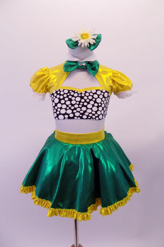 2-piece costume is a yellow pouffe sleeved half top with Peter Pan collar, black & white spotted bust & green banding along the large keyhole back. The green skirt has a yellow waistband that becomes a large bow at the back & a yellow ruffle trim. Comes with yellow gauntlets a floral hair accessory & green bow tie. Front