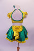 2-piece costume is a yellow pouffe sleeved half top with Peter Pan collar, black & white spotted bust & green banding along the large keyhole back. The green skirt has a yellow waistband that becomes a large bow at the back & a yellow ruffle trim. Comes with yellow gauntlets a floral hair accessory & green bow tie. Back