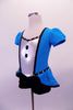 Turquoise peplum dress has a silver center with black jewelled buttons and crystalled black piping. There is a large black bow accent at the front for the peplum. The center of the back is silver with a black faux corset design. Comes with short black gauntlets and silver hair barrette. Side