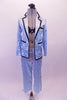Ice blue satin pyjama style costume has pull-on pants a button front shirt/jacket top with black satin trim, pockets and lapels. There is a black lacey, ruffled bra (30A) that sit beneath the top with the buttons worn open. Comes with a floral hair accessory. Front