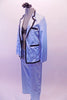 Ice blue satin pyjama style costume has pull-on pants a button front shirt/jacket top with black satin trim, pockets and lapels. There is a black lacey, ruffled bra (30A) that sit beneath the top with the buttons worn open. Comes with a floral hair accessory. Side
