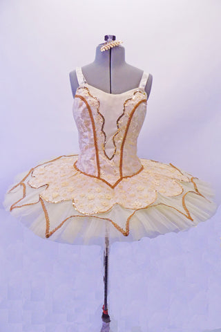 Gold & ivory tutu has a gold braided rope trim & sequin edging on the double tulle & embroidered lace overlay. The bodice is a gold & ivory brocade with sequin trimmed embroidered lace front and back center panels with gold rope braided rope accents. Bodice has a zip back & wide satin over clear elastic straps. Front