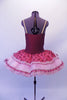 Sweet burgundy lycra bodice with corset lacing lace edged front has attached layered tutu skirt. The overlay is layers of pale pink and deep pink brocade edged with lace Comes with nude adjustable straps and floral hair accessory. Back