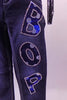 Blue jeans (size zero) with blue and white polka dot “BOP” letters on the left leg & the behind, lined with crystals. The belt is also blue & white polka dot with a large bow at the front. The matching polka dot half top has a blue fringed front, crystalled, open back & long fish-net sleeves. Comes with a newsboy hat. Side view of pant leg zoomed