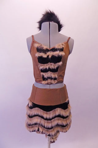 Unique two-piece costume is brown suede with black center and striped fur accents on the front of the top and back snap closure. The bottom skirt has matching striped fur that extends into a long pointy tail. Comes with fur hair accessory and long footless furry socks., Front