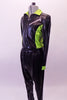 Two-piece hip-hop costume has shiny drop-crotch pants and a matching jacket. The jacket has zip front with neon green sides and collar with faux zipper painted accents at the front and back. Comes with shades. Side