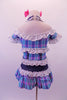 Plaid dress in shades of blue aqua and pink, has denim halter straps, waistband and crystalled faux boning accents. A wide white eyelet lace trim lines the off-shoulder top, pouffe sleeves, bust and waist. Comes with pink bow hair accessories. Back