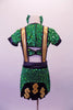 Green large sequined two-piece, money themed costume has half-top with cap sleeves and gold button front accents. The matching skort bottom has wide gold suspenders with black piping and money symbols at the back and waist front. Comes with a green bow hair accessory. Back