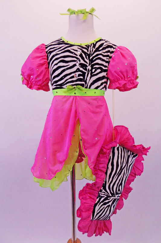 Nightdress themed costume is a hot pink and neon green with pouffe sleeves with scattered crystal accents and a zebra print torso with large crystal button accents. The costume has pink, crystalled bloomer pants to match the dress. Comes with green hair ribbons and a pink ruffled zebra pillow. Front