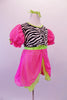 Nightdress themed costume is a hot pink and neon green with pouffe sleeves with scattered crystal accents and a zebra print torso with large crystal button accents. The costume has pink, crystalled bloomer pants to match the dress. Comes with green hair ribbons and a pink ruffled zebra pillow, Right side