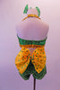 Two-piece costume is entirely green beaded sequin with gold sequin halter collar and banding. There is a large yellow organza bow with green sequin accents at the back of the shorts. Comes with green sequined hair bows. Back