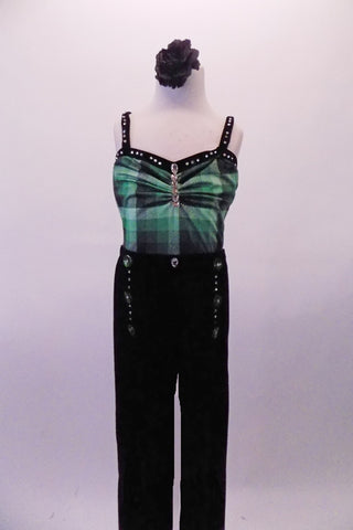 Green checkered camisole leotard has black velvet binding and straps decorated with crystals and jewel accent at the bust. The complementary black velvet pants have button and crystal accents at the hips. Comes with a black floral hair accessory. Front