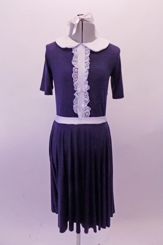 Navy blue vintage style dress has white Peter Pan collar and waistband the vertical front, lace ruffled accent band gives the costume its sweet innocence. Comes with a white ribbon hair accessory. Front