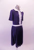 Navy blue vintage style dress has white Peta er Pan collar and waistband the vertical front, lace ruffled accent band gives the costume its sweet innocence. Comes with a white ribbon hair accessory. Side