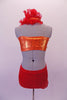 Orange bandeau & and a red brief costume is connected by a band that originates at the front of the waist in a V-shape that connects at the back of the neck. A red ruffle runs along the band of the left bust to the neck. The bandeau, waist & bands are covered with crystals. Comes with a floral hair accessory. Back