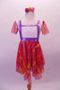 Cute dress has gold, lavender and fuchsia striped and layered kerchief skirt and sleeves. The torso is white sequined with a faux lavender pinafore accent. Comes with matching pom-pom hair accessory. Front