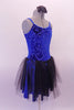 Pretty blue and black camisole dress has a blue velvet scroll pattern in the velvet. The attached blue shiny skirt has and sheer black tulle top layer that creates depth. The back is a lower scoop neck. Comes with a black floral hair accessory. Side