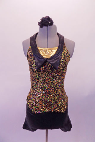 Iridescent gold swirly sequined short unitard has a black short bottom and lapel collar. A gold center inlay pops at the front bust between the collar of the halter neckline that clips at the back. Comes with a black floral hair accessory. Front