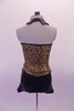 Iridescent gold swirly sequined short unitard has a black short bottom and lapel collar. A gold center inlay pops at the front bust between the collar of the halter neckline that clips at the back. Comes with a black floral hair accessory. Back