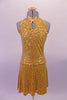 The simple but elegant gold fully sequined halter dress had a peekaboo hole at the front below the collar band. The circle skirt is a knee length and flows nicely. Comes with a gold hair accessory. Front