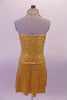 The simple but elegant gold fully sequined halter dress had a peekaboo hole at the front below the collar band. The circle skirt is a knee length and flows nicely. Comes with a gold hair accessory. Back