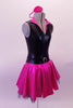 Fifty’s style dress had black leatherette sleeveless upper with a pink fold-out V-neck collar. Comes with a gold hair accessory. The attached hot-pink circle skirt has built-in tulle petticoat for volume. The faux belt waistband has a front buckle accent. Comes with matching headband accessory. Side