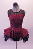 Burgundy sequined leotard dress has black sheer mesh front upper with sweetheart neckline. The sequined peplum sits on top of the open front layered black petticoat skirt, Comes with a black floral hair accessory. Front