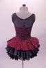 Burgundy sequined leotard dress has black sheer mesh front upper with sweetheart neckline. The sequined peplum sits on top of the open front layered black petticoat skirt, Comes with a black floral hair accessory. Back