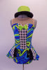 Leotard style costume with open front peplum style skirt that gives a theatrical flair. The kaleidoscopic swirls of blues & greens are contrasted with the black and white houndstooth pattern at the center of the torso and front of the open skirt. Comes with sequined lime green bow tie & green sequined top hat. Front