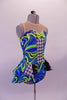 Leotard style costume with open front peplum style skirt that gives a theatrical flair. The kaleidoscopic swirls of blues & greens are contrasted with the black and white houndstooth pattern at the center of the torso and front of the open skirt. Comes with sequined lime green bow tie & green sequined top hat. Side