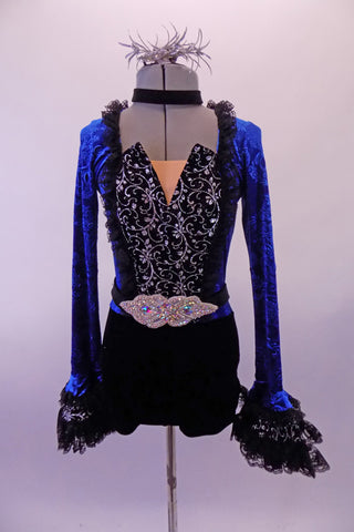 Short Gothic style unitard has a black bottom with a royal blue velvet brocade top & keyhole back. The front of the torso is black & silver print with a peaked bodice edged with black lace ruffle. The long trumpet sleeves have layered black lace.  Comes with black  appliqued belt, velvet choker & silver hair accessory. Front