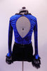 Short Gothic style unitard has a black bottom with a royal blue velvet brocade top & keyhole back. The front of the torso is black & silver print with a peaked bodice edged with black lace ruffle. The long trumpet sleeves have layered black lace.  Comes with black  appliqued belt, velvet choker & silver hair accessory. Side