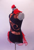Black leotard has a black lace print on nude, inlaid in a swirled pattern across the torso & open back. The left side of the neck has a red ruffle.  A double layered red curly hemmed side bustle sits along the right hip & back accented with black beaded appliques.  Comes red with a red floral hair accessory. Left side