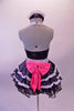 Waitress themed, 2-piece shiny black costume has sweetheart bust with halter neck. The silver sequined straps, bow tie & waistband give the costume sparkle. White lace ruffles accent the layers of the skirt with a black petticoat. The back is open with a large pink sequined bow. Comes with waitress hat accessory. Back