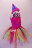 Fuchsia sequined leotard has a large round keyhole back, colourful multi-shaped buttons on the torso & a large black and white striped bow tie with a rainbow accent at the front. The multicoloured rainbow tie-knot, knee-length tutu skirt pulls on top with. Comes with purple polka dot party hat with pink feather trim. Side