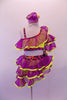 Purple organza ruffles with yellow trim create the uniqueness of this two-piece costume. The layered angled ruffles adorn the yellow, one-shouldered half-top and briefs with red-black-purple swirled banding lined with crystals. Comes with ruffled armband and hair accessory. Front