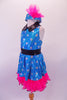 Turquoise fully sequined, silver polka dot halter dress has black waistband and collar. Hot pink ruffled petticoat sits beneath the dress and compliments the matching polka dot pill hat with pink pouffe accent. Left side