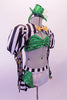 Money-themed 3-piece costume has a green sequined bra top with corset back. The bra sits beneath a black and white striped shrug jacket that has a gold bow tie. The striped pouffe sleeves have a sheer polka dot long sleeves.  The bottom is a white brief with striped bustle skirt with green accents & gold dollar symbol. Right side