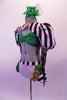 Money-themed 3-piece costume has a green sequined bra top with corset back. The bra sits beneath a black and white striped shrug jacket that has a gold bow tie. The striped pouffe sleeves have a sheer polka dot long sleeves.  The bottom is a white brief with striped bustle skirt with green accents & gold dollar symbol. Left side