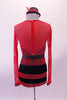 Red leotard has sequined sweetheart neckline edged with crystals, attached to a red sheer long sleeved upper & a low drop back. The high waisted brief is black & red vertical stripes. The back of the brief is layers of black & red fringe. Comes with striped footless fringed stockings, appliqued belt &  mini-top hat. Back