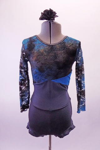 Grey, blue and black unitard has a lace bust and sleeves in shades of black grey and blue. The front is a closed round neck and low scoop back. The center of the torso is a sheer grey that attaches the bust and the grey banded leg booty shorts. Comes with a floral hair accessory. Front