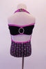 Purple and silver square glitter design halter style open backed leotard has black velvet front bottom. The open front is pinched together below the bust by a permanent jewelled front clasp. The black velvet bandeau bra with purple trim, has a large circular crystal accent at both front and back. Comes with hair accessory. Back