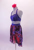 Three-piece costume has a navy-blue halter bra top with pinched front and matching briefs. The chiffon high-low skirt has a marbled pattern of blue, black and crimson to create the pop of colour. Comes with a crimson floral hair accessory. Side