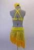 Salsa dress in lemon yellow has a halter neck bra with cross back straps & lime green accent at the left shoulder. A yellow fringe accents the front of the bra & compliments the wide yellow fringe of the attached angled skirt. The skirt with brief is attached to the bra by a yellow band on left side of the torso. Back
