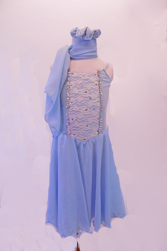 Pale blue chiffon dress has white lace front scattered with crystals and edged with silver braiding. The back is connected by a set of criss-cross straps lined with crystals. Comes with a chiffon scarf and matching hair accessory. Front