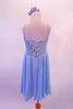Pale blue chiffon dress has white lace front scattered with crystals and edged with silver braiding. The back is connected by a set of criss-cross straps lined with crystals. Comes with a chiffon scarf and matching hair accessory. Back