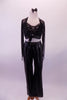 Black leatherette pants with crystal buckle has a matching bra with crystal accents. The black sheer glitter shrug ties at the front over the bra. Comes with leather bow hair accessory. Front